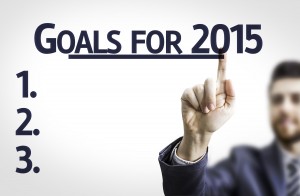 Business man pointing the text: Goals for 2015
